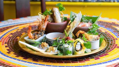 Macron Savors Vietnamese Spring Rolls and Vermicelli Soup in Hanoi