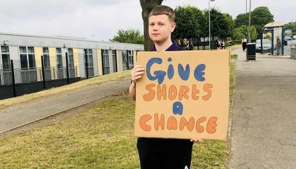 Students protest school dress code outside campus