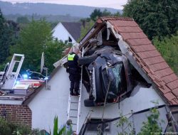 Germany: Car Crashes Into Trampoline, Stuck in Barn Roof