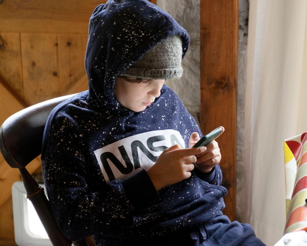 Kids curb phone use to boost mental well-being, study reveals