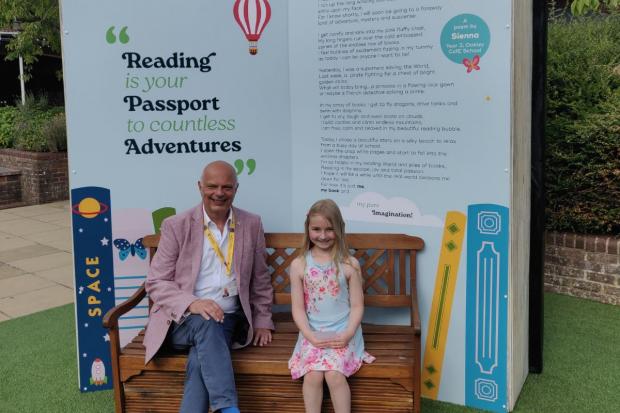 Community garden at shopping center opens with book-themed twist