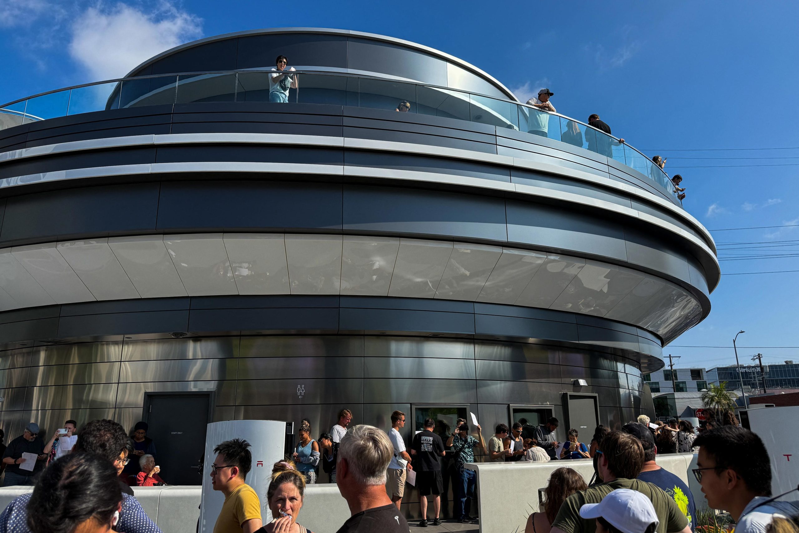 Elon Musk Fans Crowd Tesla Diner Opening: See the Photos