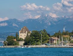 A Fairytale Lakeside Town Between Geneva and Bern With Pastel Homes and Medieval Charm