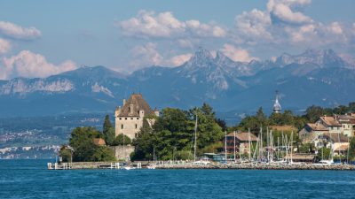 A Fairytale Lakeside Town Between Geneva and Bern With Pastel Homes and Medieval Charm