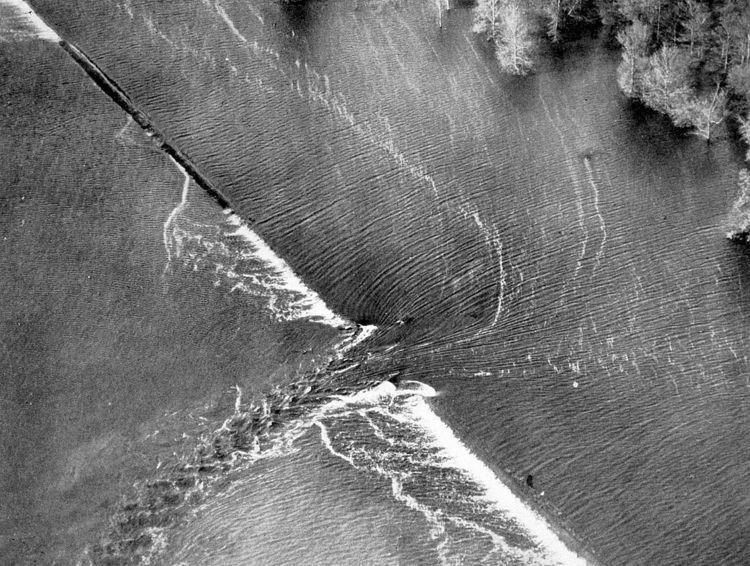 Levee breach floods villages and farmland